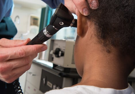 A child is examined in the Ear, Nose, and Throat clinic.