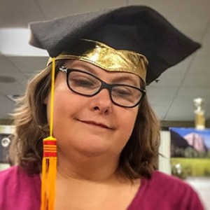 Jenifer Wilson with mortar board on head