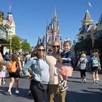 Erika Mendence with partner and child at Disney 