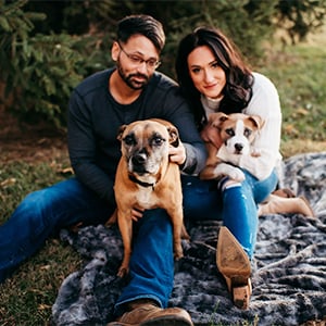 Brittany Rospierski, her fiancé, and their two dogs, Boone and Rosie, on their farm.
