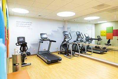 Parent Exercise Room at Children's Mercy Adele Hall. Three pieces of exercise equipment are shown, including a treadmill.