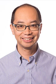 Dr. Sherwin Chan smiling in front of a white background.