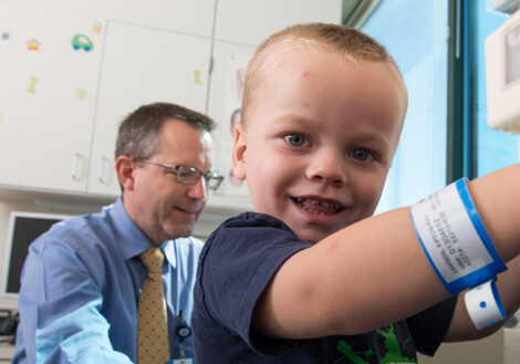 A child is seen by a physician in the Ear, Nose, and Throat clinic at Children's Mercy.