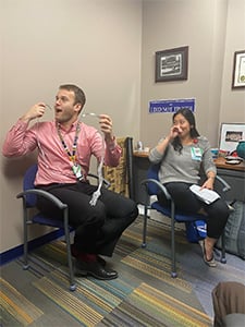 Two GI fellows sitting in chairs with surprised looks on their faces