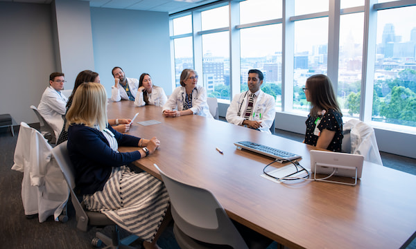 Several physicians are gathered around a conference table at Children's Mercy Kansas City
