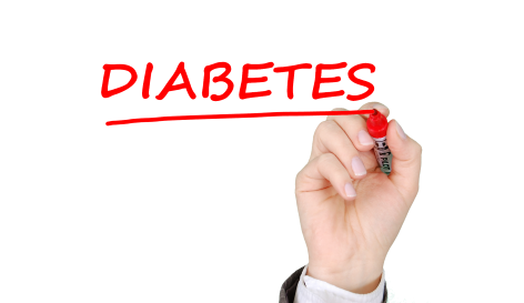 A hand holding a red marker and underlining the handwritten word "DIABETES."