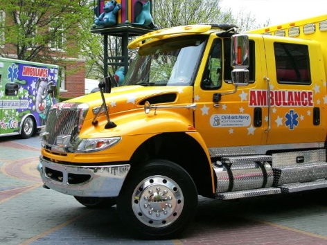 A photo of a yellow Children's Mercy ambulance
