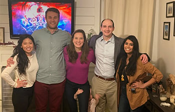 Five GI fellows smiling with arms around each other