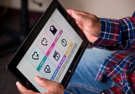 A man holds up the CHAMP technology at Children's Mercy.