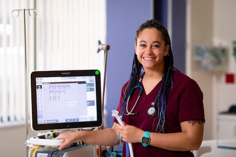 Myranda, a respiratory therapist at Children's Mercy, holds a tube attached to a medical machine