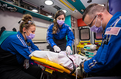 Dr. Jennifer Ruiz  working with members of Children’s Mercy’s critical care transport team.