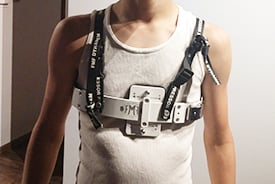 Close-up of Rogan wearing his customized brace with an undershirt.