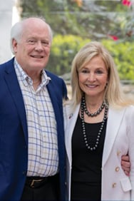 Paul and Linda DeBruce smiling at the camera.