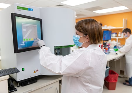 Fellow starting a batch of DNA isolation on a Chemagen.