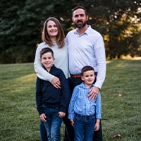 Carey Bickford with her husband and their two sons.