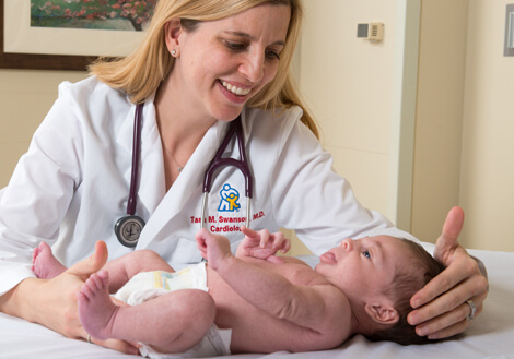 Dr. Swanson from Children's Mercy with patient