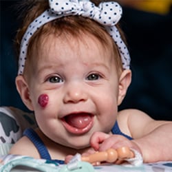 1-year-old Lillian smiling.