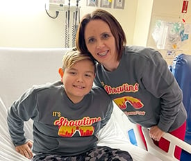 Hayden Murnahan and his mother smiling during preparation for his transplant at Children's Mecy.