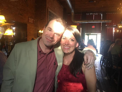 Two members of the Children's Mercy Child Neurology Residency team pose together in a restaurant.