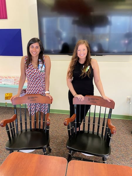 Two women stand together at the Pediatric Hematology Oncology Fellowship graduation.