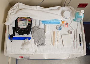 An EMU tech prepares a child for their test at Children's Mercy.