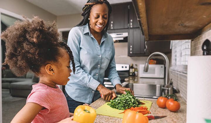 mom and daughter chop vegetables celiac disease