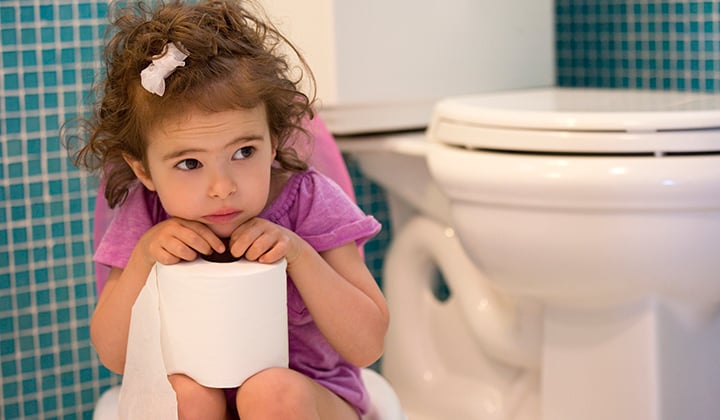 Child on the toilet learning to potty train