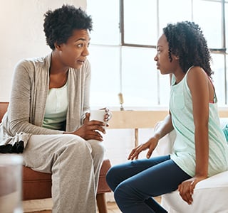 Mother talking with her daughter