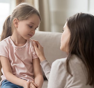 Mom consoling daughter