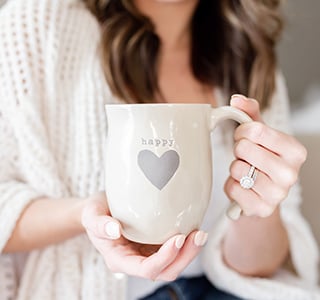 Woman holding coffee mug