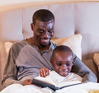 Dad reading to child