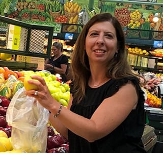 woman grocery shopping on a budget