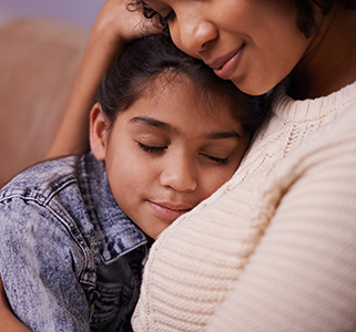 Mom holds young daughter