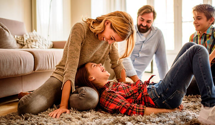 family playing together on the floor