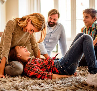 family playing together on the floor