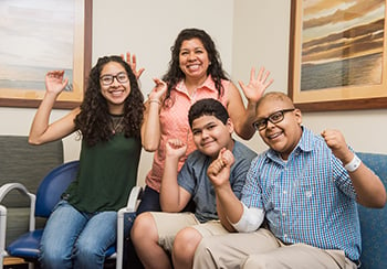 The Cisneros family celebrating Miqueas' recovery in the Cancer Center at Children's Mercy.
