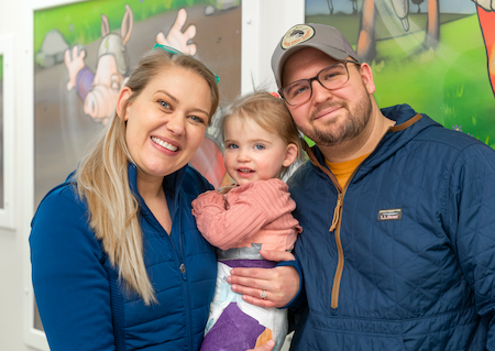2-year-old hip patient, June, with her mom and dad.