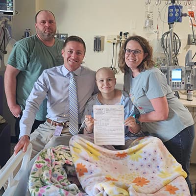 Matney's family celebrates good labs with Kevin Campbell, MD, her oncologist.