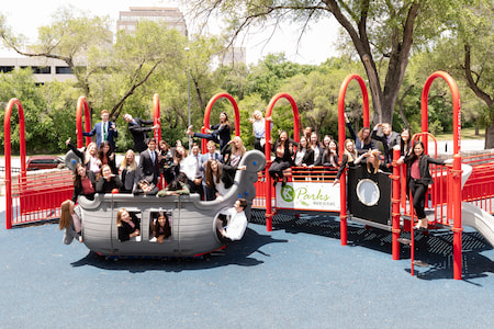 Children's Mercy Pediatric Residents pose together on a Kansas City park structure