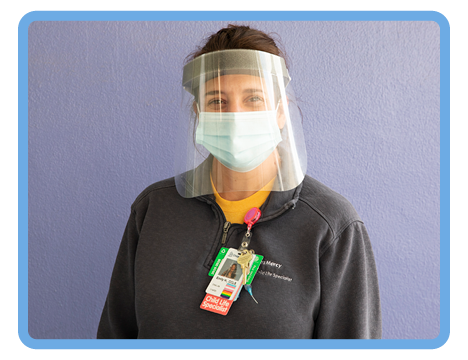 Child Life specialist in face shield and mask