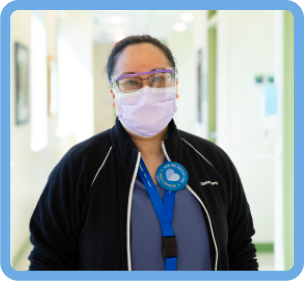 Staff member in face mask and face shield