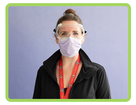 Children's Mercy staff member in protective eye googles and face mask