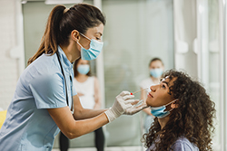 child getting nasal swab test