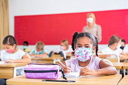 child inside school with mask